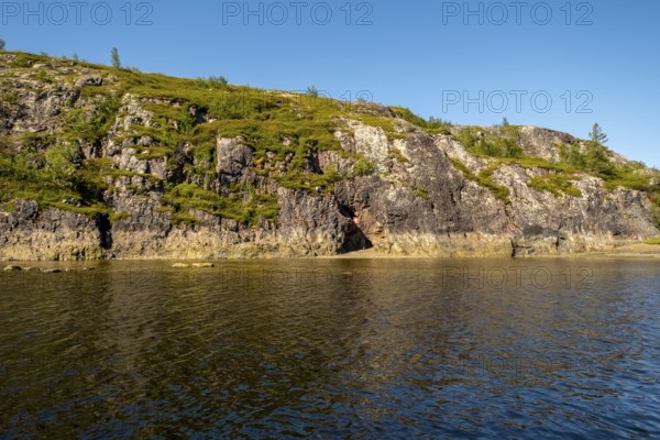Rocky coast, cave entrance, bowøynes, Finnmark, Norway, Scandinavia, Europe, adventure trip,