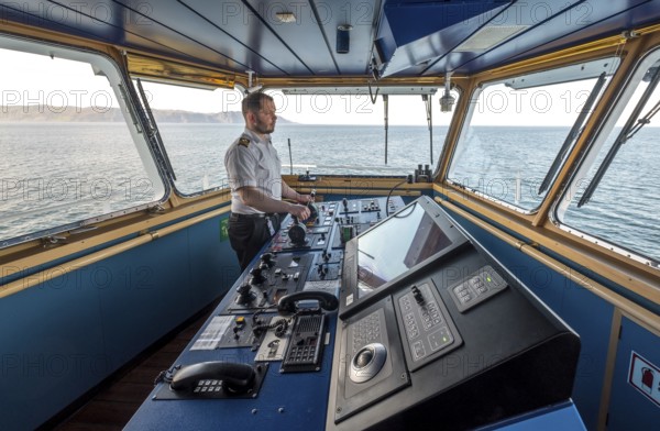 MS Polarlys, command bridge, officer on bridge, Honningsvåg, Finnmark, Norway, Scandinavia, Europe,