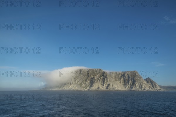 Island in the fog, Kjøllefjord, Finnmark, Norway, Scandinavia, Europe, adventure travel, tourism,
