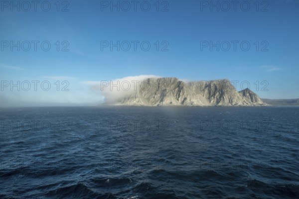 Island in the fog, Kjøllefjord, Finnmark, Norway, Scandinavia, Europe, adventure travel, tourism,