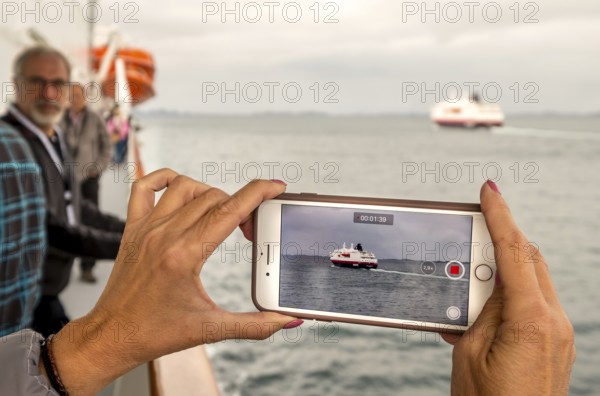 Ship MS Kong Harald, mobile phone photography, ship filming, Bolga, Nordland, Norway, Scandinavia,