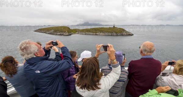 Arctic Circle Globe, Polar Circle Globe, Vikingen Island, photographing tourists, Tonnes, Nordland,