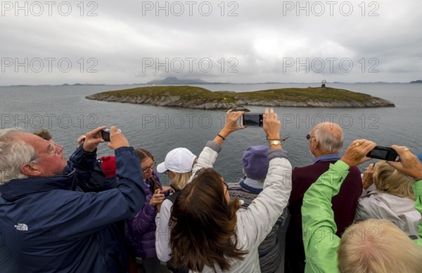 Arctic Circle Globe, Polar Circle Globe, Vikingen Island, photographing tourists, Tonnes, Nordland,