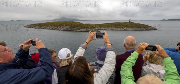 Arctic Circle Globe, Polar Circle Globe, Vikingen Island, photographing tourists, Tonnes, Nordland,