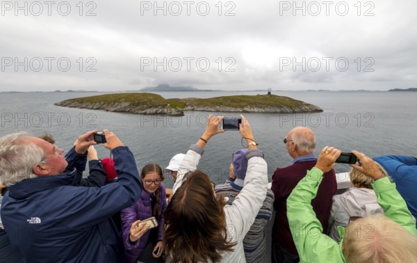 Arctic Circle Globe, Polar Circle Globe, Vikingen Island, photographing tourists, Tonnes, Nordland,