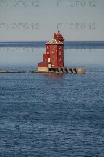 Kjeungskjær Fyr, red lighthouse, off the Norwegian coast on a small archipelago off Ã˜rland,