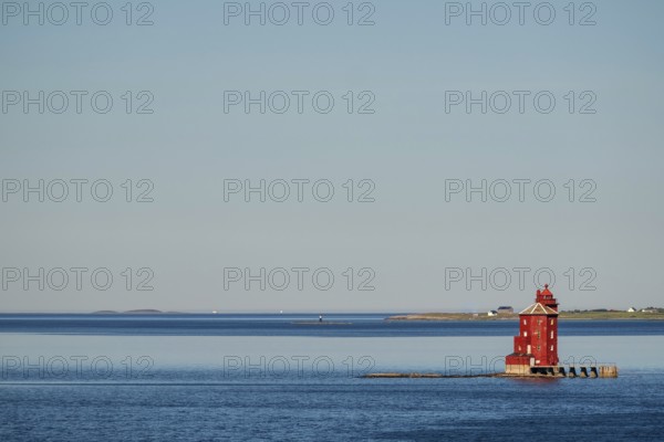 Kjeungskjær Fyr, red lighthouse, off the Norwegian coast on a small archipelago off Ã˜rland,