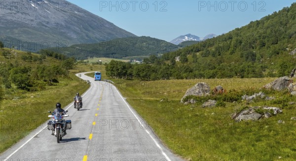 Motorcyclist and coach on the European route 63, Geiranger, Møre og Romsdal, Norway, Scandinavia,