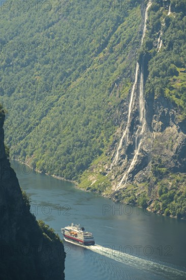 Ship MS Polarlys in fjord, waterfall, Bringefossen also called Gomsdalsfossen, Geirangerfjord,