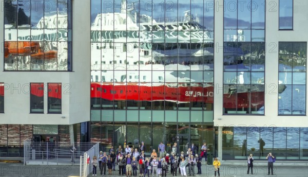 Cruise ship MS Polarlys, reflection, tourists at the quay, Ã...lesund, Møre og Romsdal, Norway,