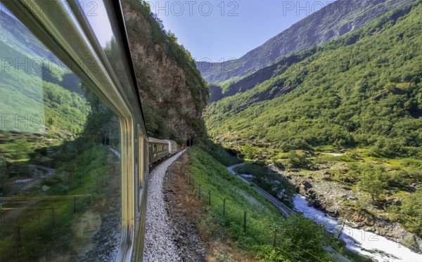 Journey by Flam Railway, iron railway journey, view from Flåmsbana, Ryavegen, entrance to tunnel,