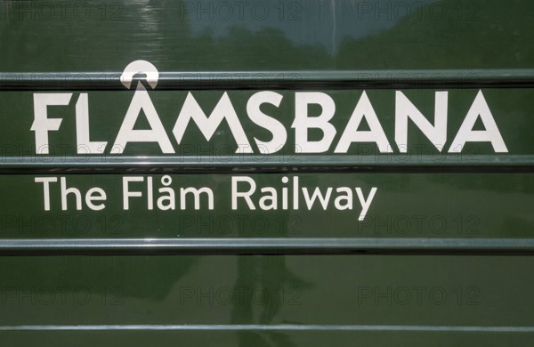 Journey on the Flam Railway, iron railway, green train with white lettering FlÃ¥msbana, The Flam