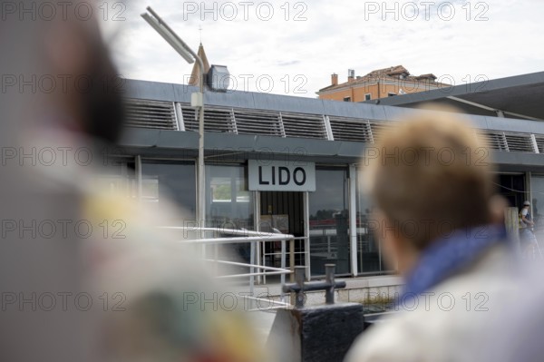 Venice, Italy - 2 September 2025: Passengers disembark from a passenger ship on the Lido during the