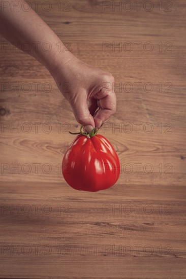 Khinkali tomatoes, on a wooden cutting board, wooden background, no people