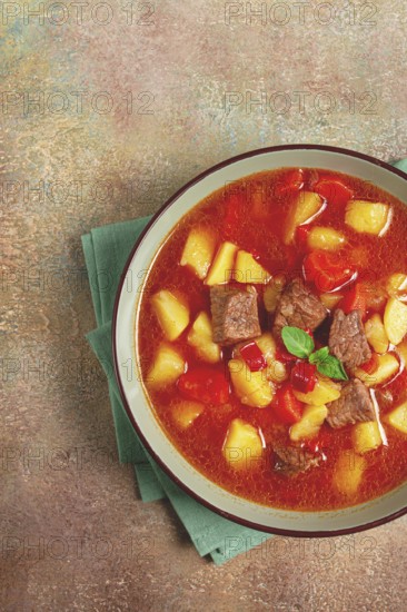 Meat goulash, with potatoes and carrots, sweet pepper, traditional Hungarian soup, homemade, no