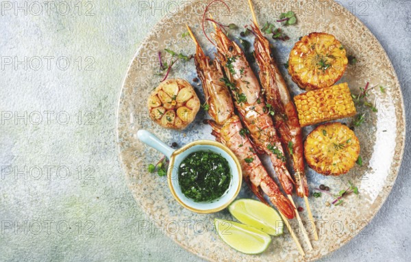 Langoustines on skewers, shrimp kebab, with fried corn, spices and herbs, homemade, no people