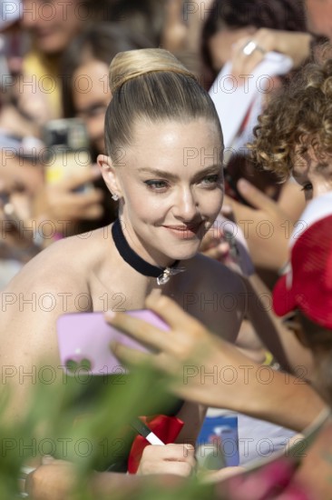 Venice, Italy - 1 September 2025: Amanda Seyfried signing autographs during the Red Carpet of - The