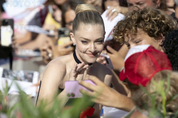Venice, Italy - 1 September 2025: Amanda Seyfried signing autographs during the Red Carpet of - The