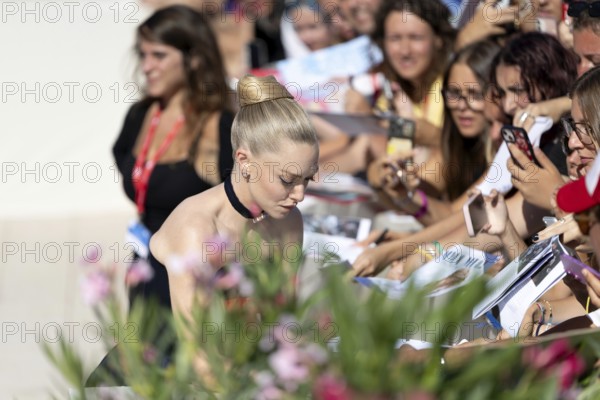 Venice, Italy - 1 September 2025: Amanda Seyfried signing autographs during the Red Carpet of - The