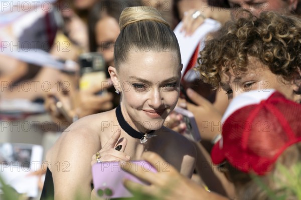 Venice, Italy - 1 September 2025: Amanda Seyfried signing autographs during the Red Carpet of - The
