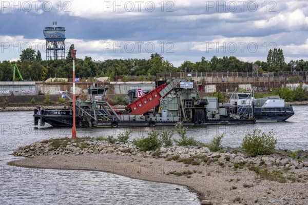 Bucket chain dredger at work on the Rhine near Duisburg, between the Neuenkamper Rhine Bridge and