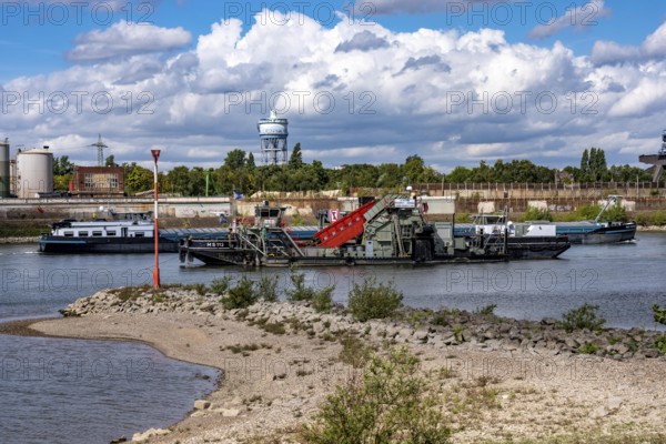 Bucket chain dredger at work on the Rhine near Duisburg, between the Neuenkamper Rhine Bridge and