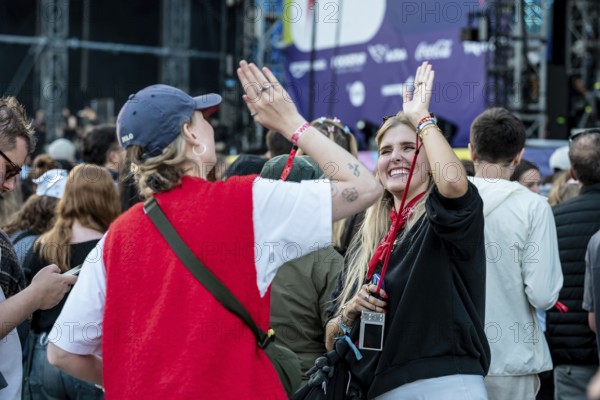 Visitors celebrate during Nelly Furtado's performance at the Superbloom Festival, Day 1 at the