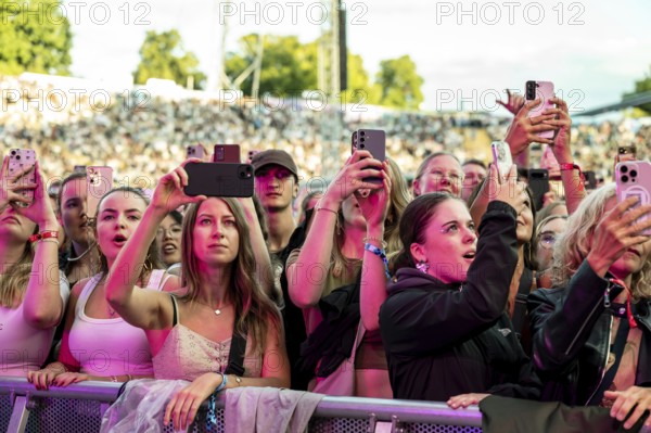 Visitors film the performance of Nelly Furtado with their mobile phones at the Superbloom Festival,