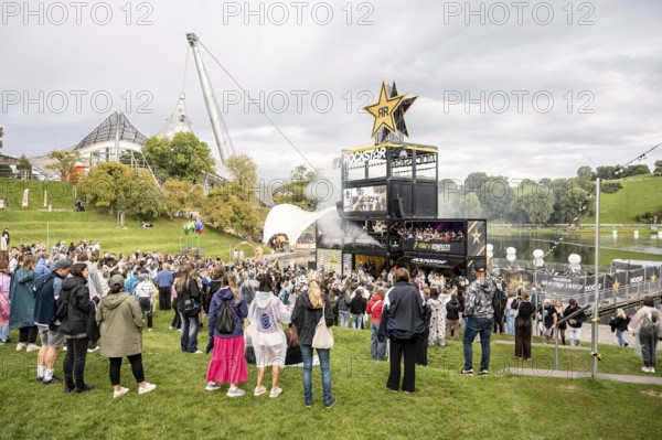 Festival visitors celebrate on the Rockstar Energy Tower at the Superbloom Festival, Day 1 in the