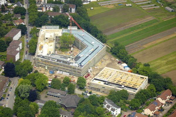 Aerial view, construction site with new building of the Anne-Frank comprehensive school on Obere