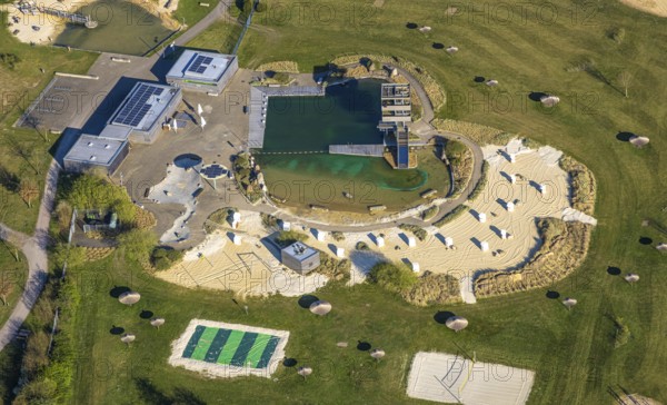 Aerial view, natural swimming pool Olfen outdoor pool and sandy beach and water playground,