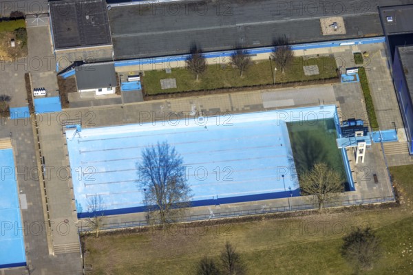 Aerial view, outdoor and indoor swimming pool, tree reflected in the pool, Meschede town, Meschede,
