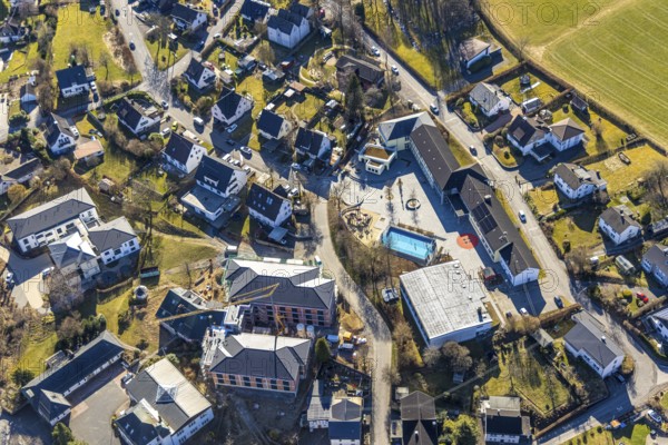Aerial view, community primary school, below construction site with new building for new senior