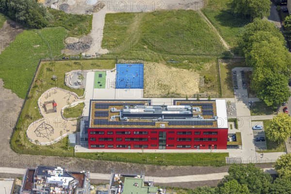 Aerial view, community primary school Schule am Schloss with red facade, roof with solar panels,