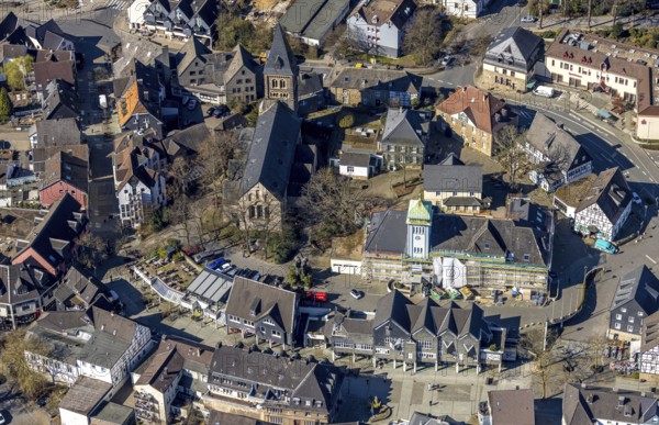 Aerial view, town hall in the old town building site with renovation and covered house facade with