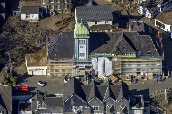 Aerial view, town hall in the old town centre construction site with renovation and covered house