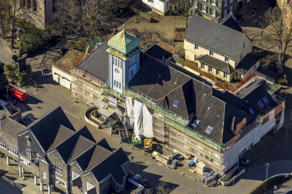 Aerial view, town hall in the old town centre construction site with renovation and covered house