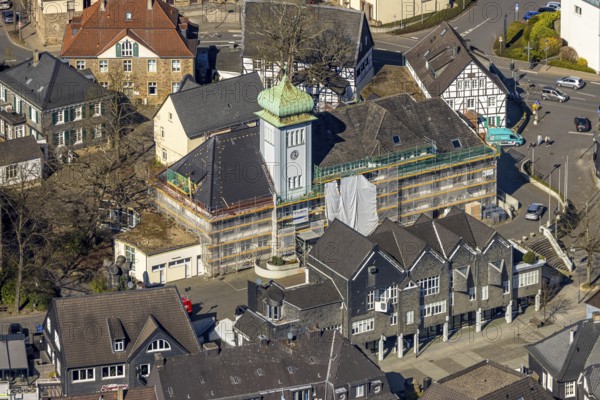 Aerial view, town hall in the old town centre construction site with renovation and covered house