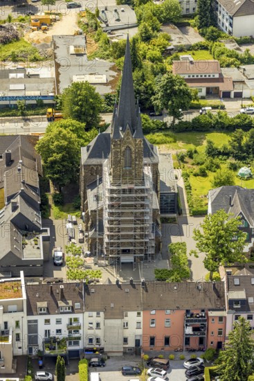 Aerial view, construction site catholic church St. Suitbertus with scaffolding on the church tower,