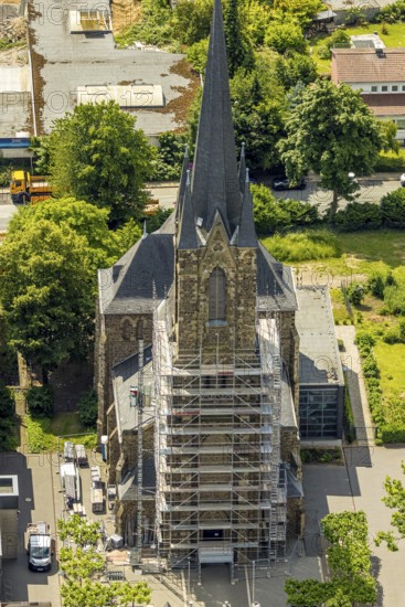 Aerial view, construction site catholic church St. Suitbertus with scaffolding on the church tower,