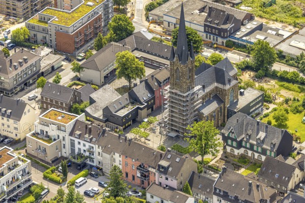 Aerial view, construction site catholic church St. Suitbertus with scaffolding on the church tower,