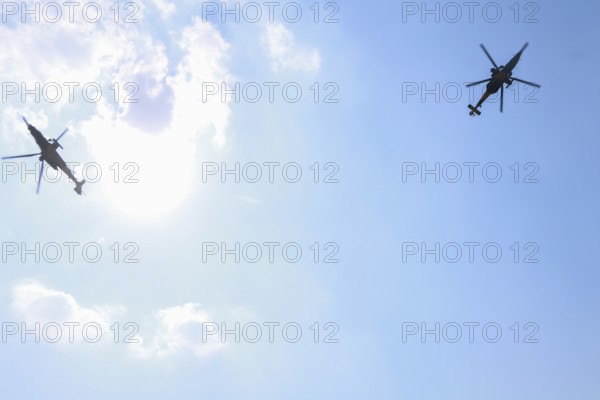 Turkish Air Force helicopters and fighter jets perform aerobatic maneuvers during Teknofest