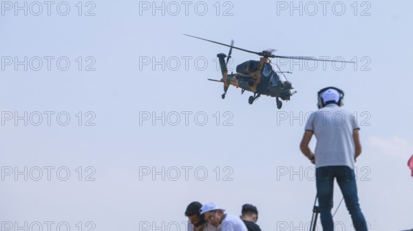 Turkish Air Force helicopters and fighter jets perform aerobatic maneuvers during Teknofest