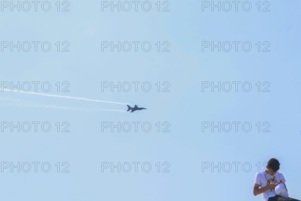 Turkish Air Force helicopters and fighter jets perform aerobatic maneuvers during Teknofest
