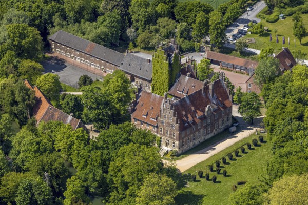 Aerial photo, storks and their nests on the roof of Heessen Castle, stork droppings on the roof,
