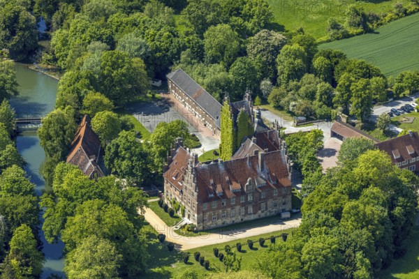 Aerial photo, storks and their nests on the roof of Heessen Castle, stork droppings on the roof,