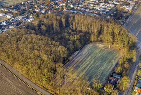 Aerial view, wooded area with shadows cast by trees on the football pitch Am Sportplatz corner An