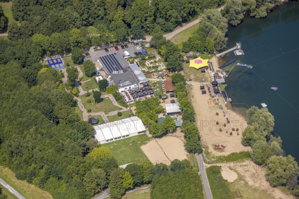 Aerial view, water skiing facility and leisure centre at Toeppersee, gastronomy with sunshades,
