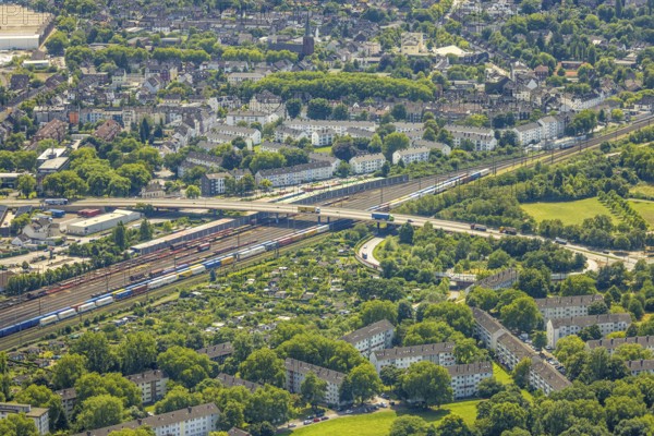 Aerial view, railway line with container site and bridge Friedrich-Ebert-Straße with curved road