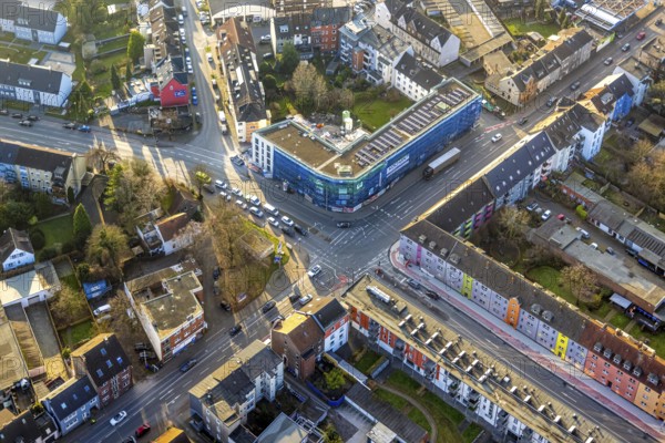 Aerial view, residential area and construction site with new residential building on the corner of